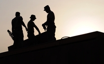 Workers on a roof