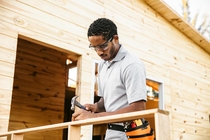 Man using a hammer outdoors