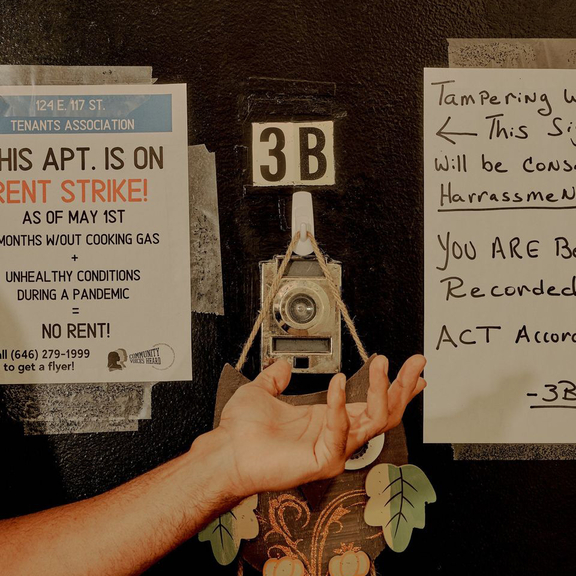 Apartment door with notes that occupant is on rent strike