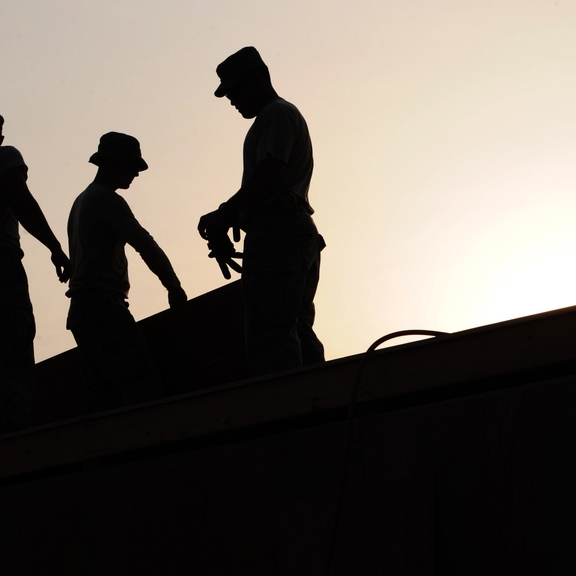 Workers on a roof