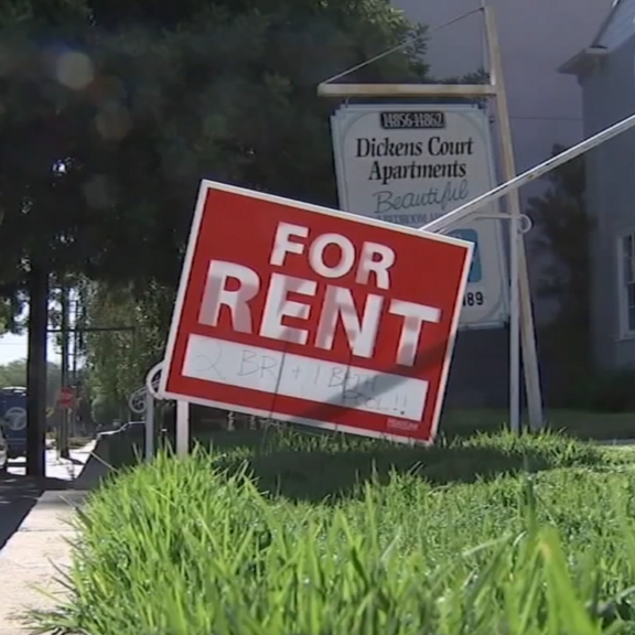 For-rent sign in front yard.