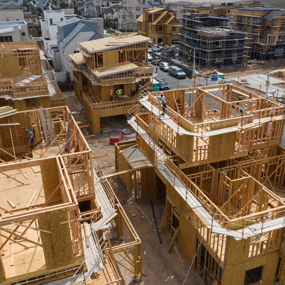 Houses under construction, showing wood frames.