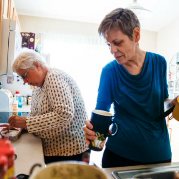 Two older women in their kitchen