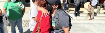  Janine Nkosi, a member of the Fresno-based advocacy group Faith in the Valley, hugs a resident of Trails End Mobile Home Park after a ruling to allow an investor group to buy the park.