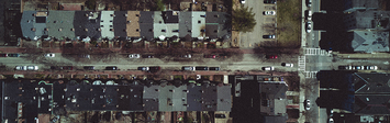 Aerial view of small apartment buildings.